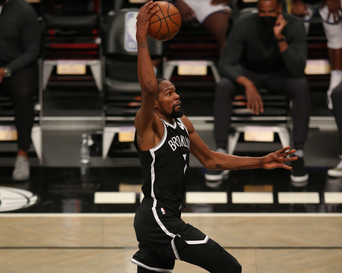 Brooklyn Nets forward Kevin Durant dunks against the Golden State Warriors during the third quarter at Barclays Center.